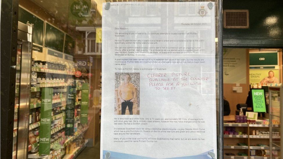 Wanted poster on display in a store