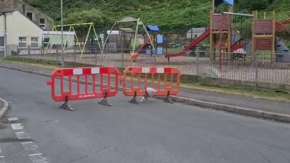 Barriers in road by children's play park