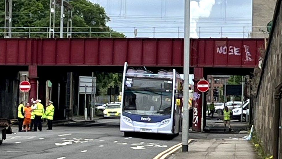 Double decker bus roof ripped off in Fauldhouse bridge crash - BBC News