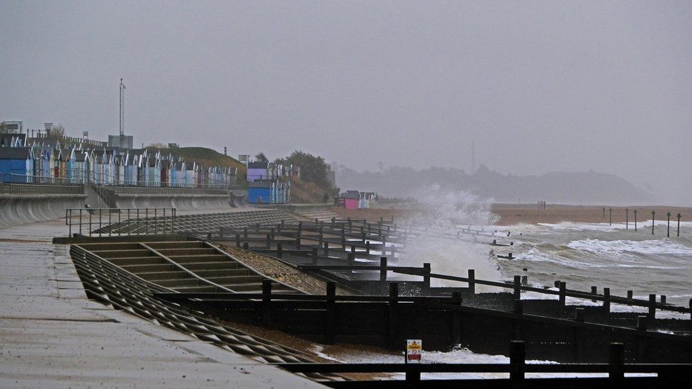 A beach scene in Felixstowe, Suffolk with stormy conditions and water seen to be blowing off the sea