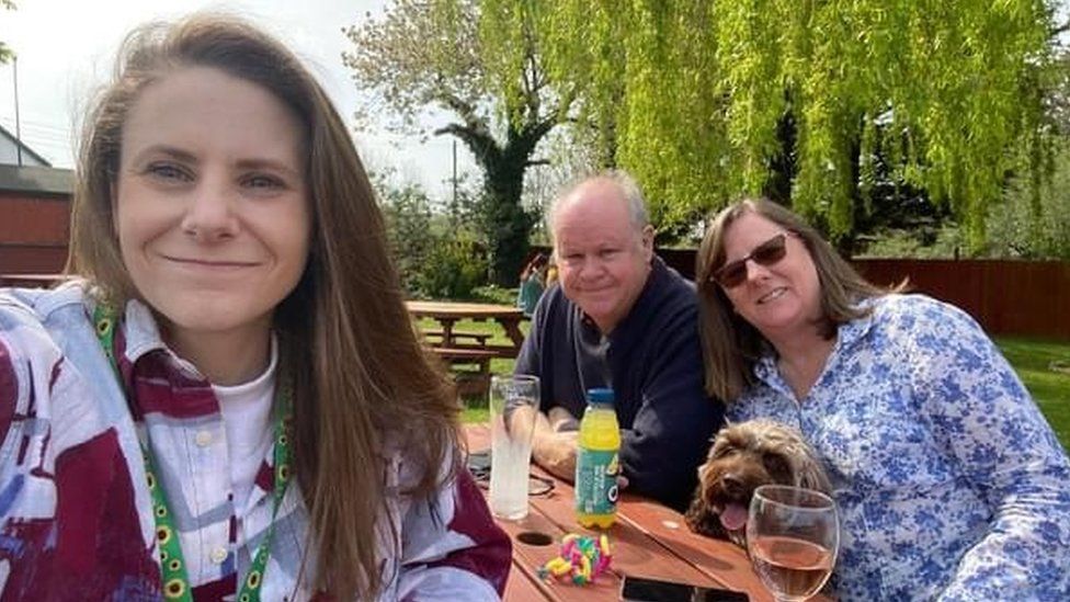 Molly Leonard with her parents after coming out of hospital in Bristol in April