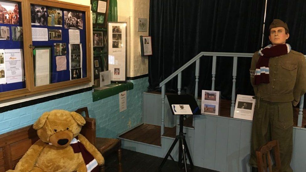 The museum exhibition showing photographs and exhibits