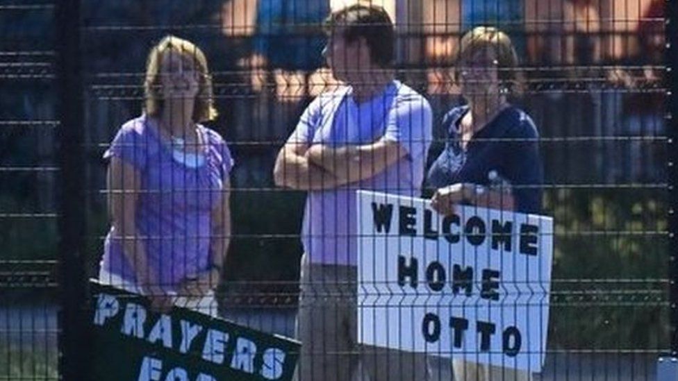 Local residents hold signs of support to welcome home Otto Warmbier at Lunken Airport in Cincinnati, Ohio, US, June 13, 2017.