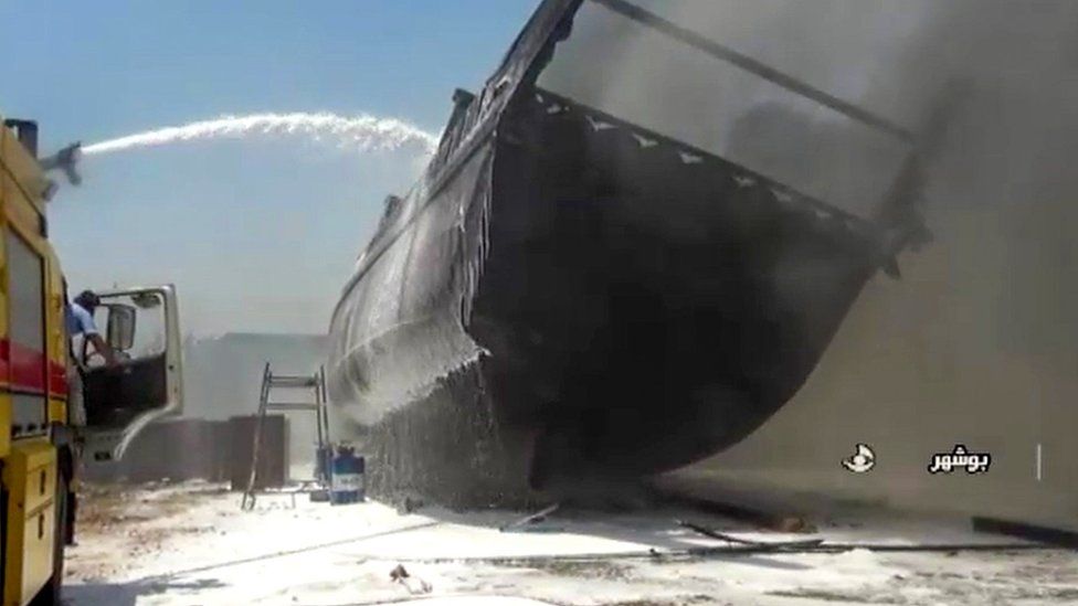 Screengrab taken from Iranian state TV showing ship on fire at shipyard in Bushehr, Iran (15 July 2020)