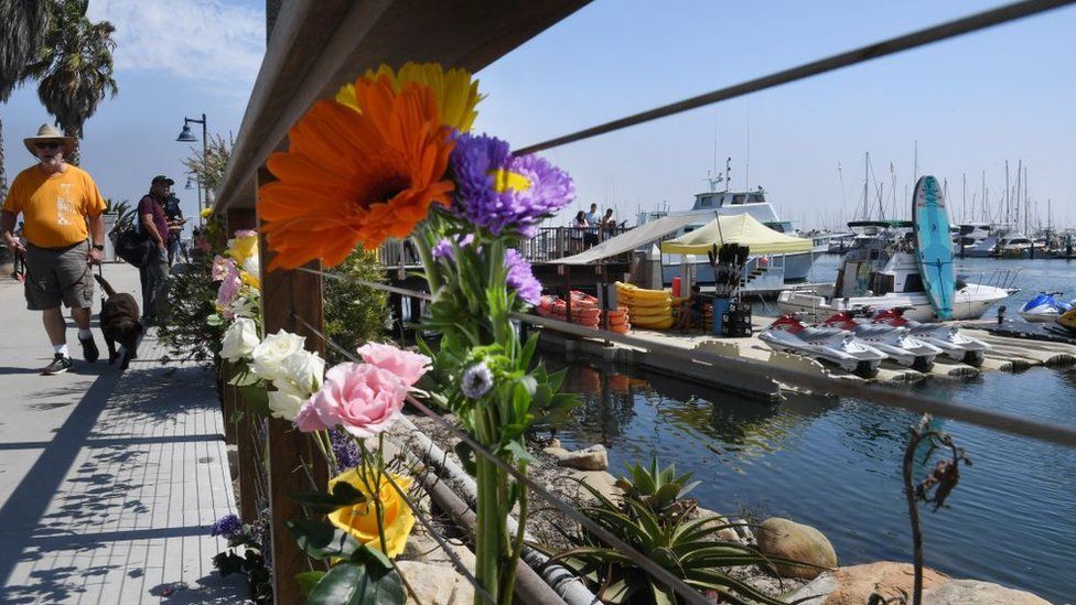 People have left flowers at the dock where the Conception is based
