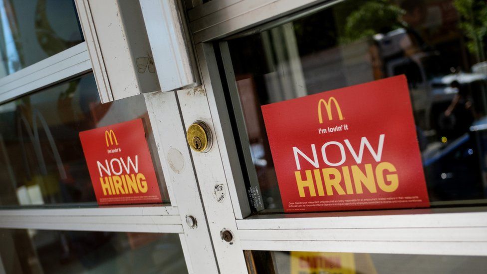 'Now Hiring' signage is displayed on the entrance to a McDonald's restaurant in Lower Manhattan, June 2, 2017 in New York City.