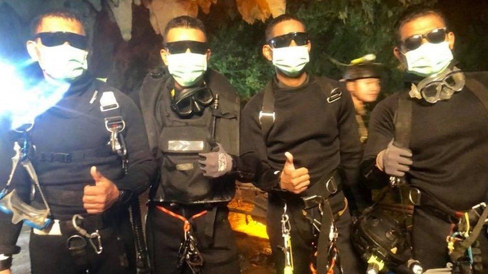A handout photo made available by Thai Navy Seal Facebook page on 10 July 2018 shows the last four of Thai Navy Seals members, who stayed with the boys and their coach inside a cave until they all were rescued, at the Tham Luang cave in Chiang Rai province, Thailand