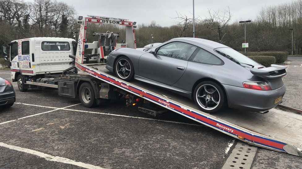 Andrew Warner's Porsche 911 being collected on a recovery truck at Clacket Lane