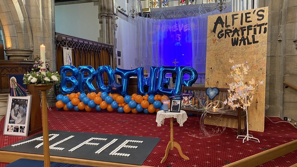 Altar at Alfie's funeral with mementoes