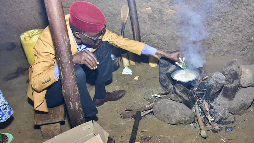 MP Didmus Barasa makes tea at a fireplace