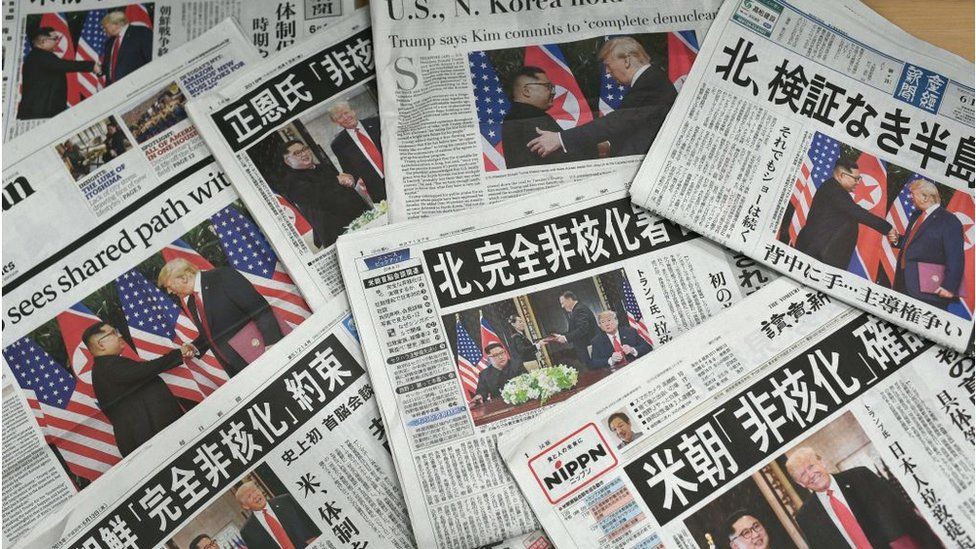 Newspapers showcasing the landmark US-North Korea summit between Donald Trump and Kim Jong Un