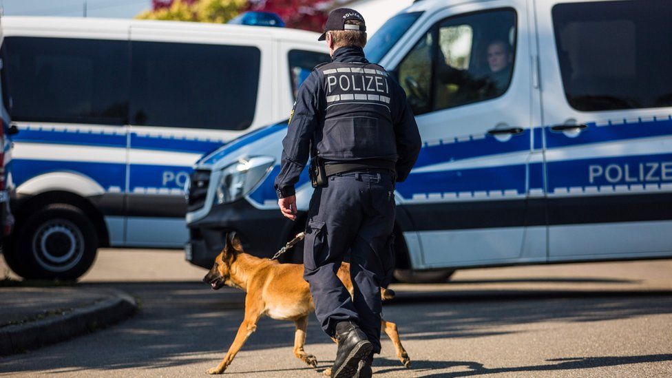 Police officer with a dog in Rotttenburg am Neckar, Germany, following the arrest of a man over the Dortmund bus bombing (21 April)