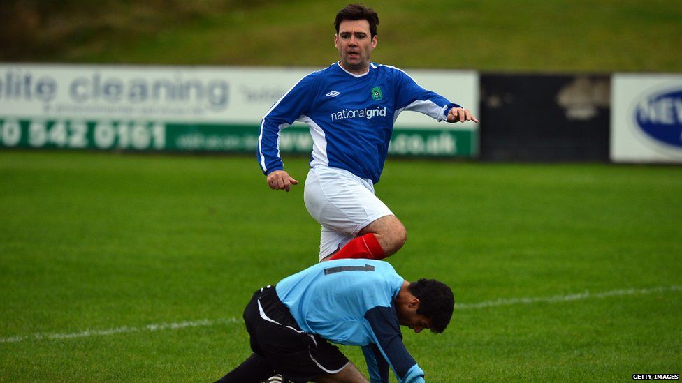 Andy Burnham playing footballf