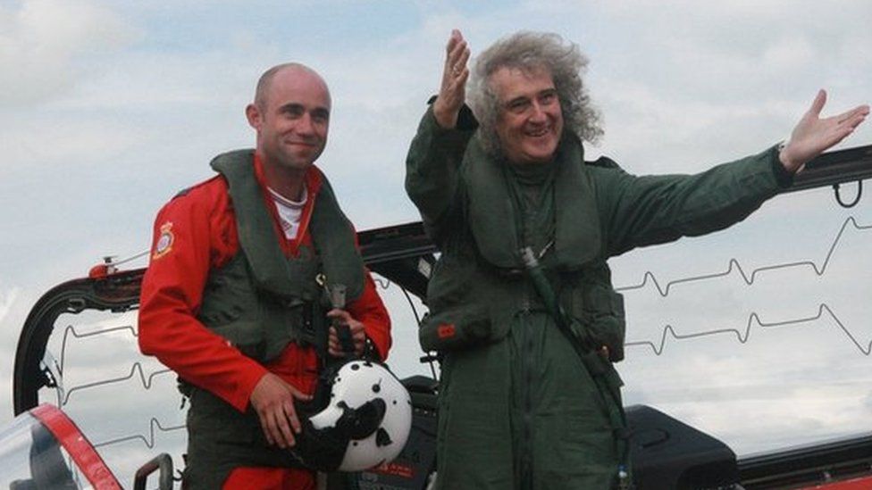 Flight Lieutenant Ben Plank with Queen guitarist Brian May