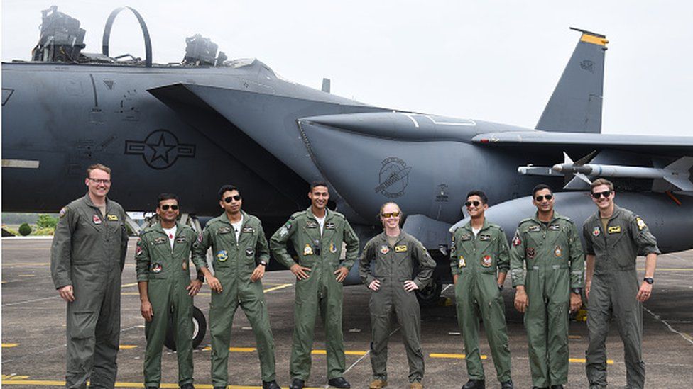 The United States Air Force (USAF) and Indian Air Force (IAF) personnel are posing in front of a United States Air Force (USAF) F-15 Eagle fighter jet during the joint 'Exercise Cope India 2023' at the air force station in Kalaikunda, around 170 km west of Kolkata, on April 24th, 2023. T