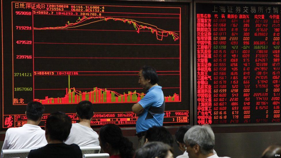 Investors monitor stock market data at a securities brokerage house in Beijing, China, 28 August 2015.