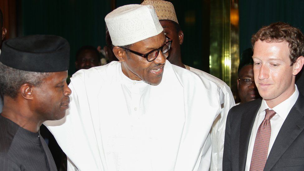 Nigerian President Muhammadu Buhari (C) and Vice President Yemi Osinbajo (L) are visited by Facebook founder Mark Zuckerberg (R) at the presidential palace in Abuja