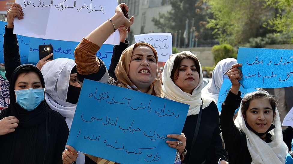 Afghan women and girls take part in a protest in front of the Ministry of Education in Kabul on March 26, 2022