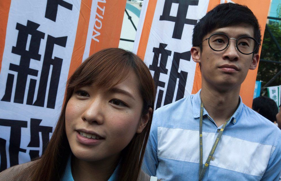 Legislative Councillors-elect Yau Wai-ching (L) and Sixtus Leung (R) are seen as thousands of people march through the streets of Hong Kong to protest against the Legislative Council oath-taking interpretation of the city's Basic Law, or mini-constitution, by the Chinese authorities in Beijing, Hong Kong, China, 6 November 2016