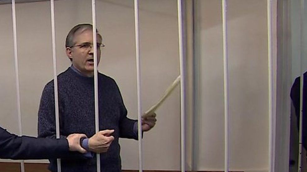 Paul Whelan reads out statement in court, behind bars