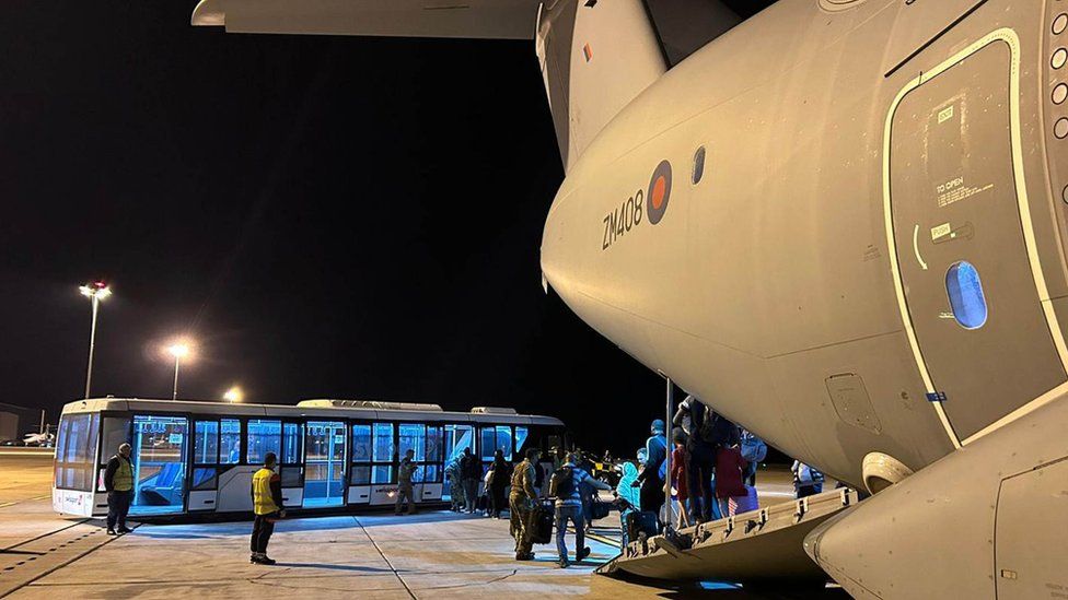 UK nationals disembarking from a RAF transport plane at Larnaca airport in Cyprus