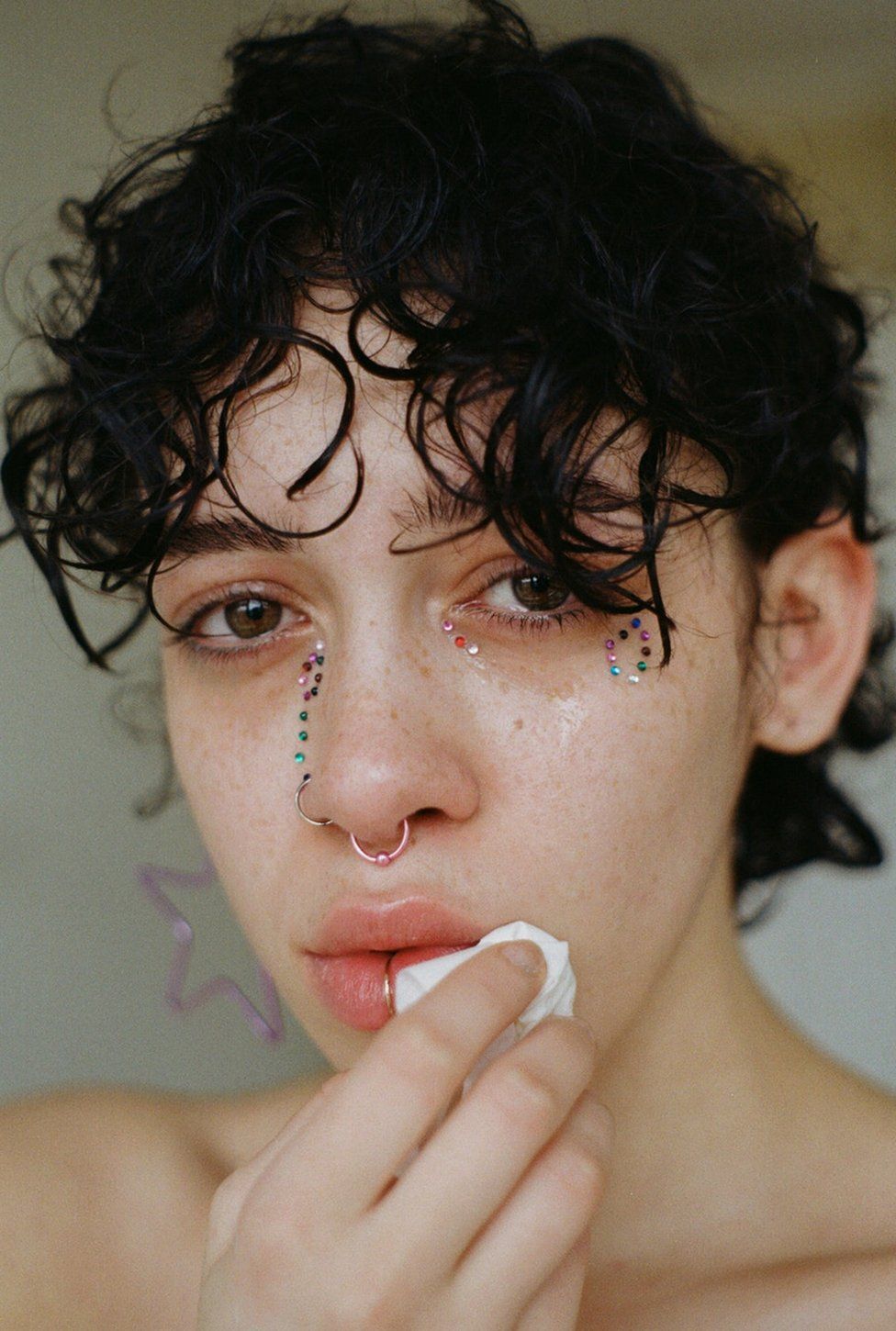 Portrait of a young woman sequins on her face