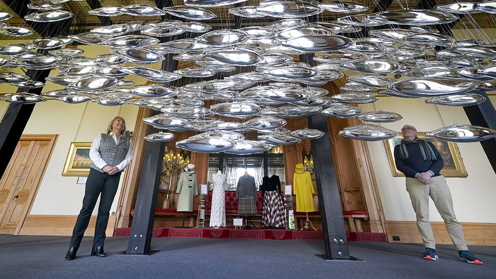 Artist Joseph Rossano and assistant curator Sarah Hoare view The Salmon School art installation on display in the Castle Ballroom at the opening of Life at Balmoral, the Platinum Jubilee exhibition at Balmoral Castle, in Royal Deeside, Aberdeenshire