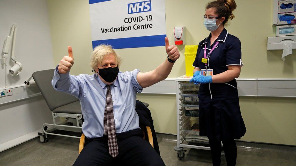 The PM gives his thumbs up after receiving the jab