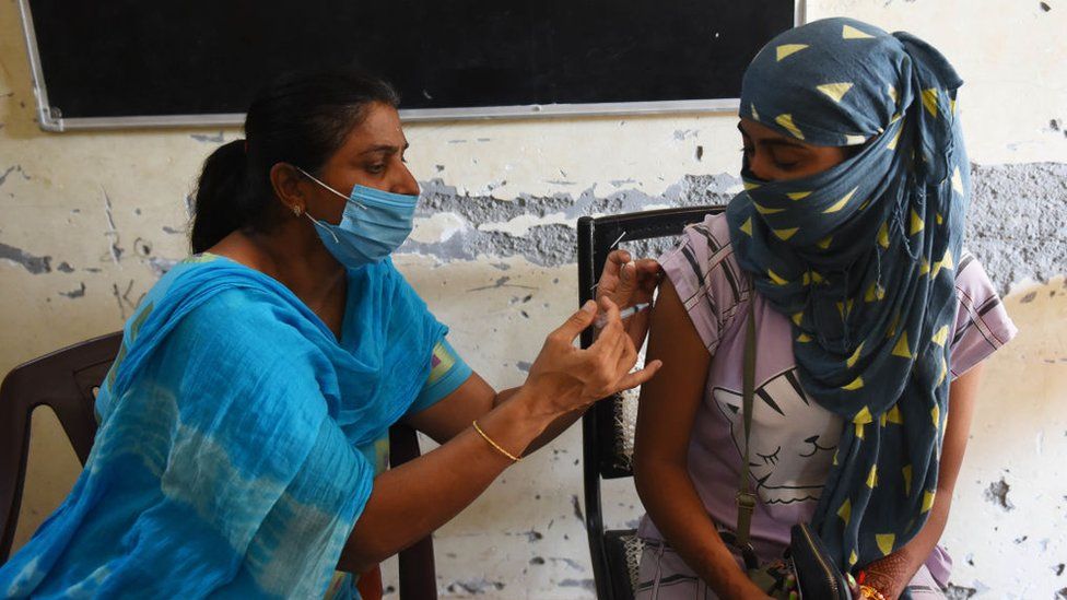 A woman gets the second shot of the Covishield vaccine at a centre in a government school in Shivaji Nagar, on August 25, 2021 in Gurugram, India