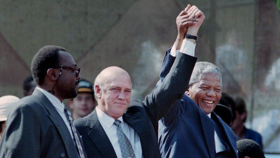 Newly elected South African president Nelson Mandela held hands with former South African president F.W. de Klerk in Cape Town South Africa, in 1994.