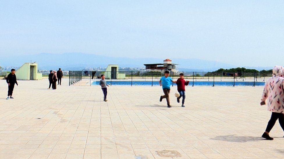 Displaced children play football at the Hotel Montana in Marwaniyeh, Lebanon