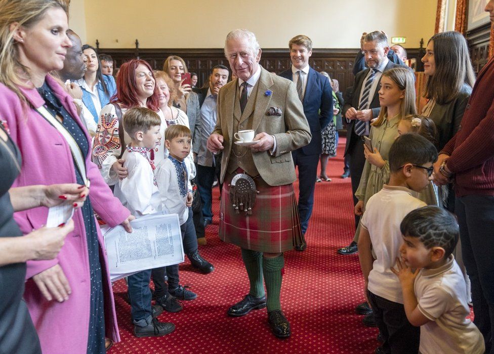 The King meets refugees in Aberdeen