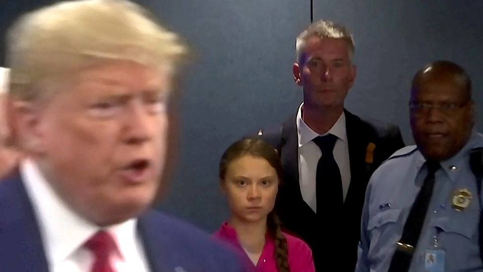 Greta Thunberg looks on as Donald Trump speaks