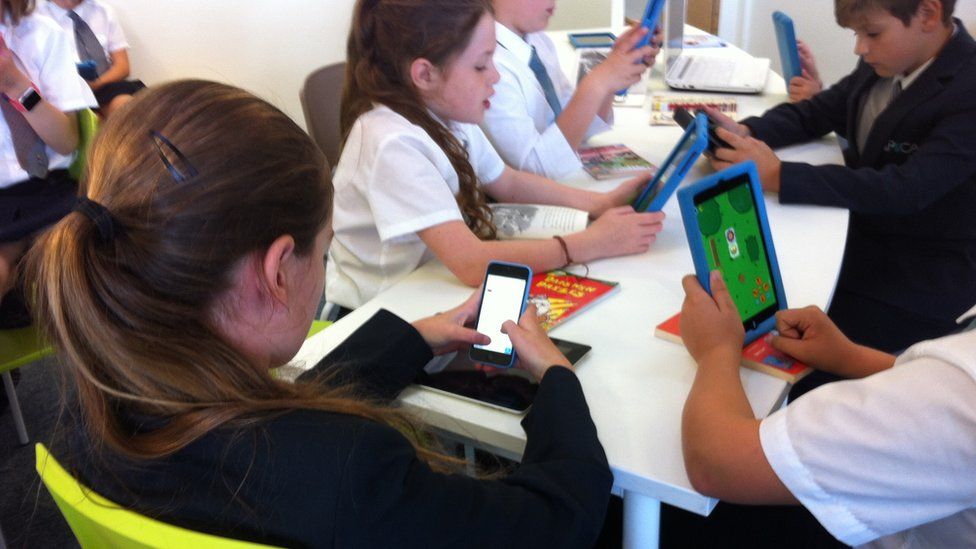 Students learning using smart devices