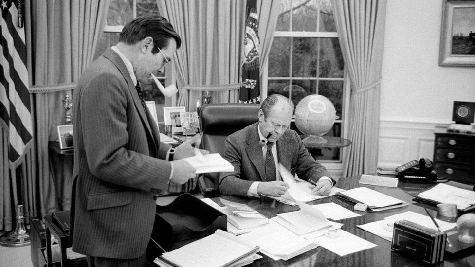 U.S. President Gerald Ford meeting with Donald Rumsfeld at the White House in 1975