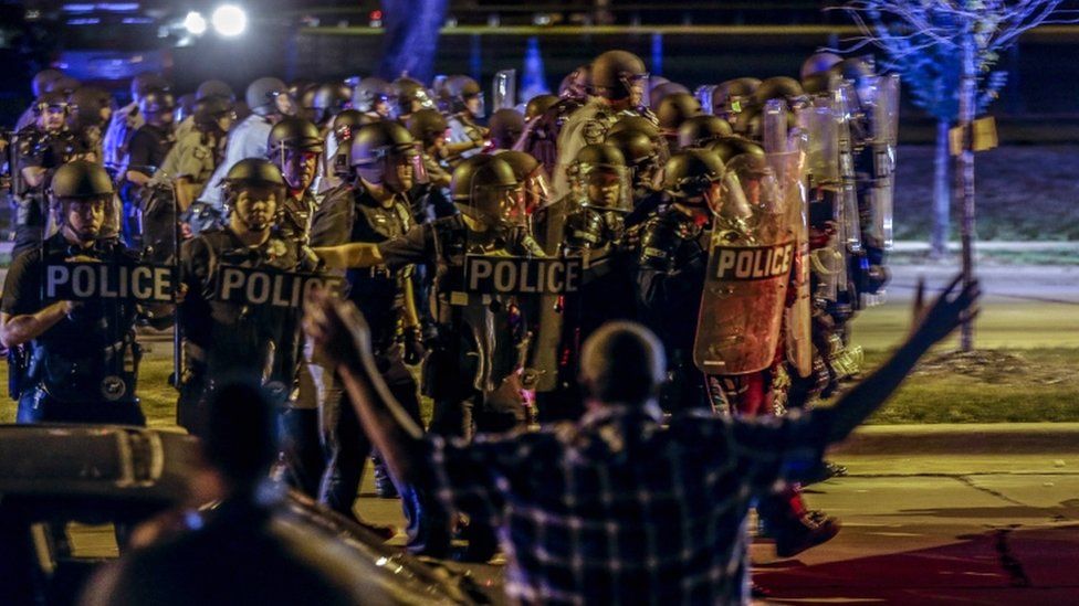 Police and protesters in Milwaukee, 14 August