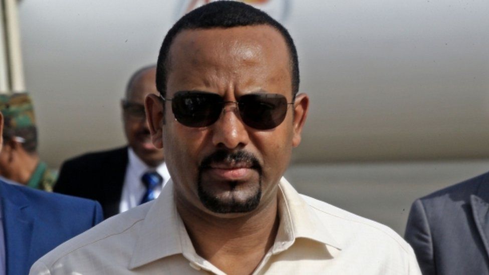 In this file photo taken on June 07, 2019 Ethiopia"s Prime Minister Abiy Ahmed (C) arrives at Khartoum international airpor