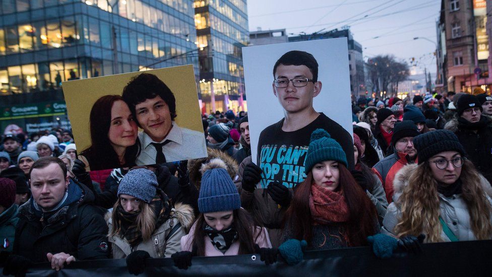 People hold portraits of murdered Slovak journalist Jan Kuciak and his girlfriend Martina Kusnirova during a silent protest march in their memory on March 2, 2018 in Bratislava, Slovakia.
