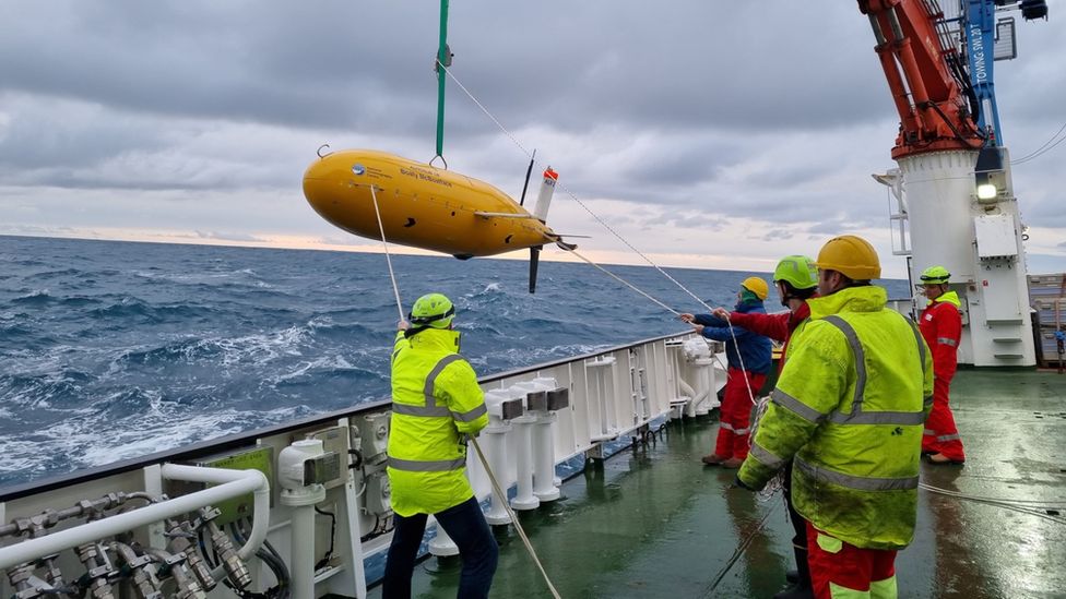 Boaty McBoatface is craned from a ship
