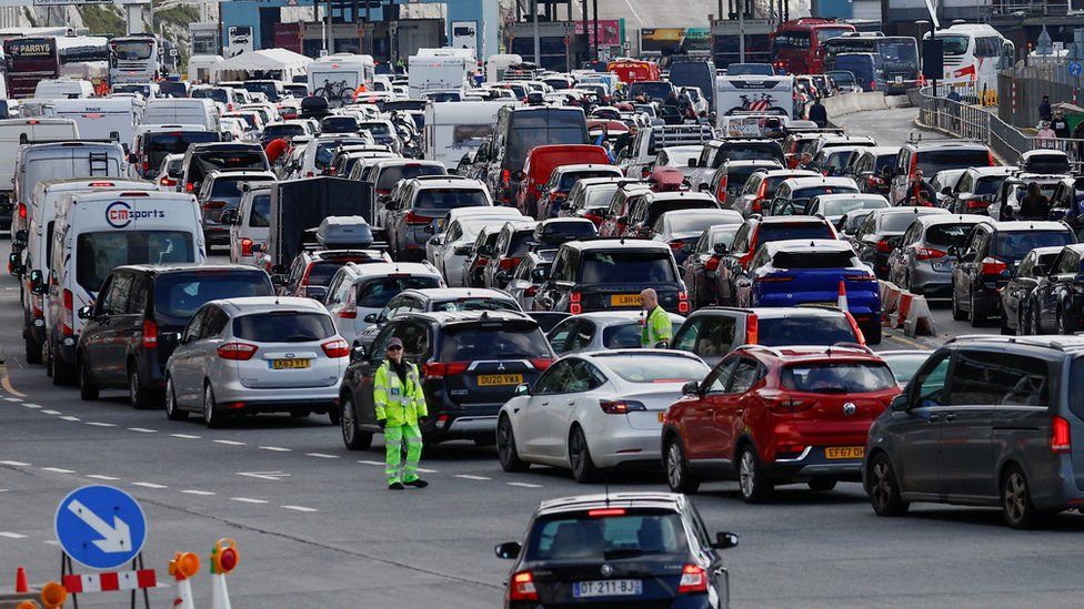 Vehicles wait to check-in ahead of departure on ferries at the Port of Dover