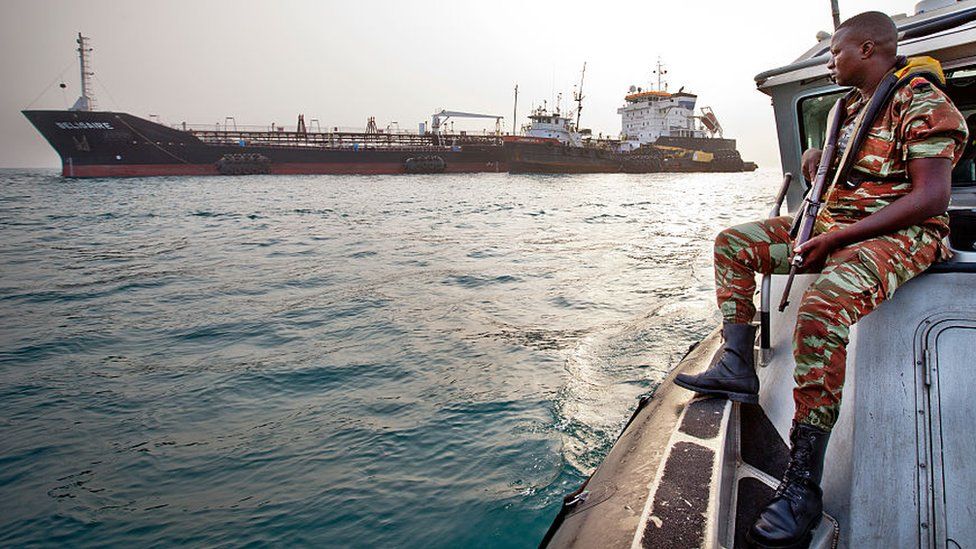 A Beninese anti-piracy guard patrolling the sea