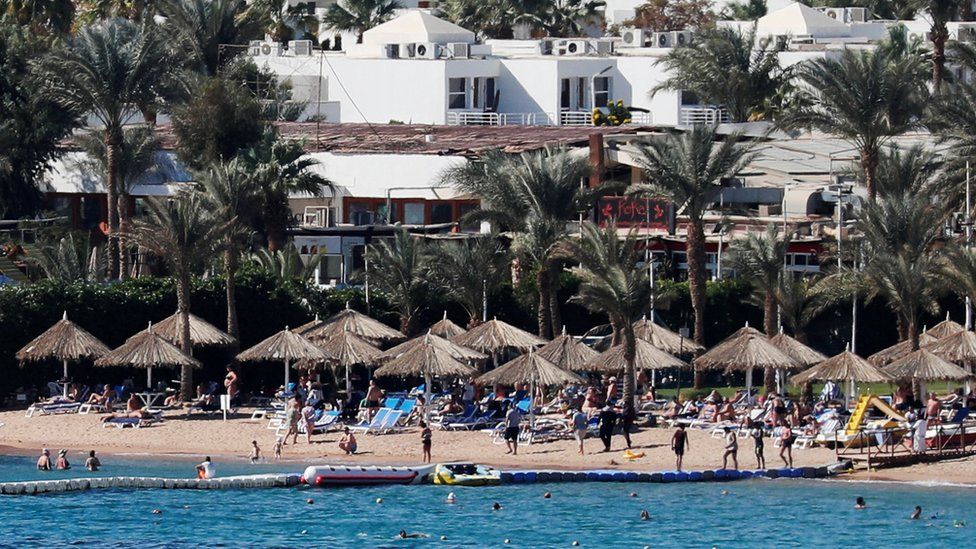 Tourists enjoy the water on a beach at the Red Sea resort of Sharm el-Sheikh, south of Cairo, Egypt