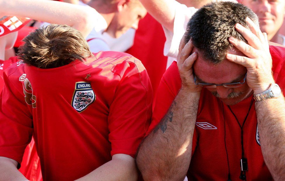 England fans look dejected in Gelsenkirchen, Germany, after England's exit from the 2006 World Cup quarter final match against Portugal, which they lost on penalties