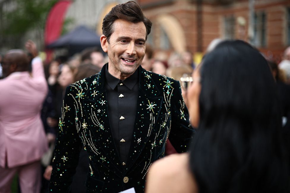 British actor David Tennant speaks to guests on the green carpet upon arrival to attend The Olivier Awards at the Royal Albert Hall in central London on April 14, 2024
