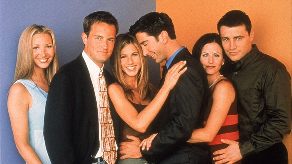 The Friends cast in 1996, with Ross and Rachel in the middle