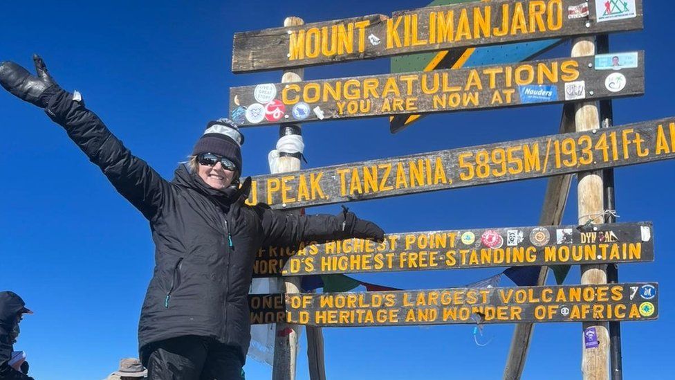 Gillian Millane at the peak of Mount Kilimanjaro