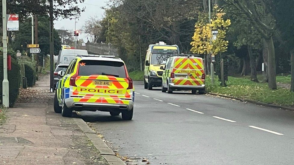 Bedfordshire Police cars responding to the Bury Court armed siege