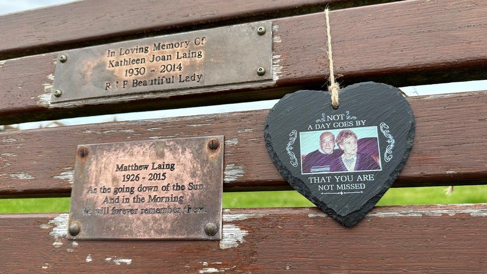 Close up of plaques on the bench