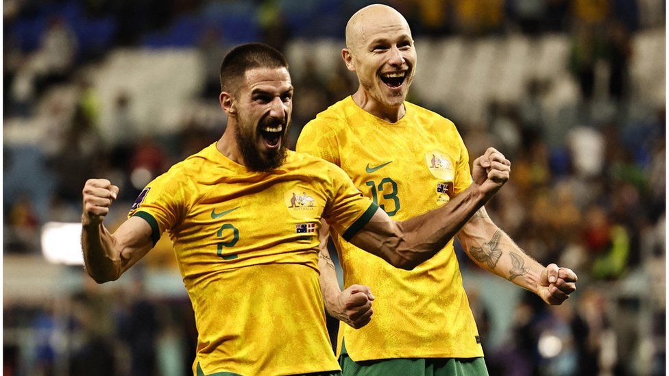 Two Australian players celebrate at the World Cup in Qatar