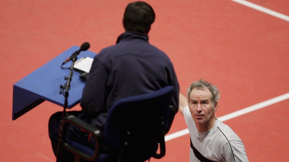 John McEnroe disputes a line call with an umpire in 2005